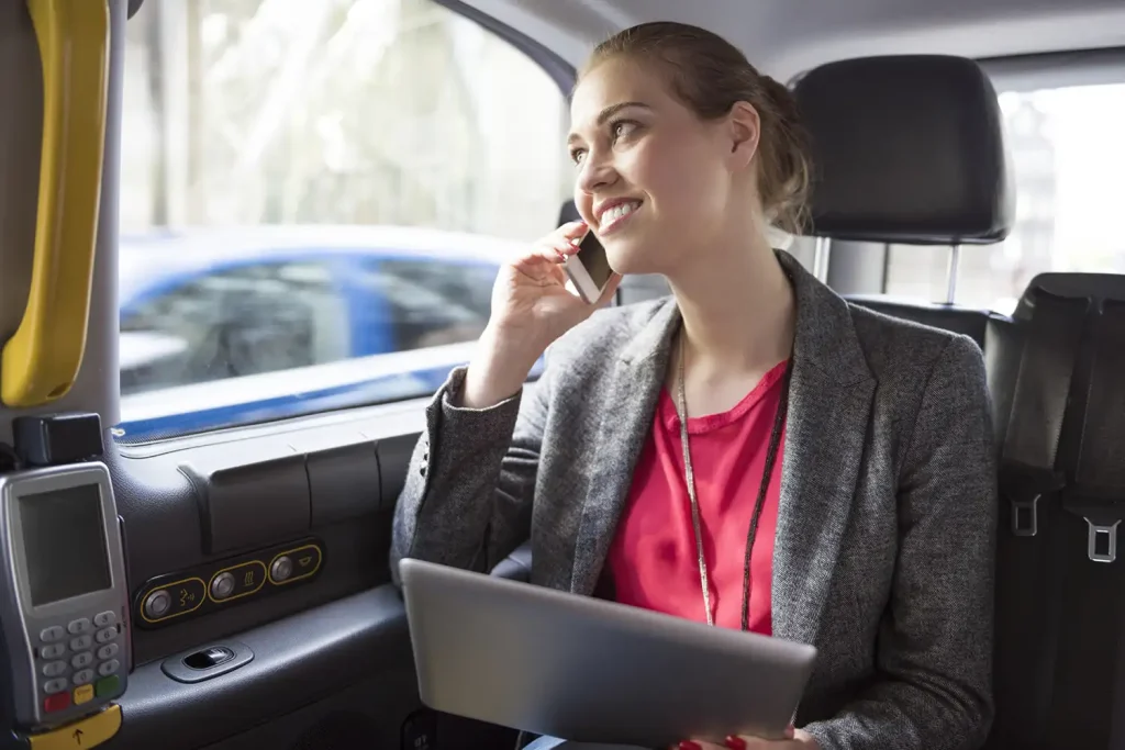 businesswoman working while drive a taxi 2021 08 26 20 15 37 utc